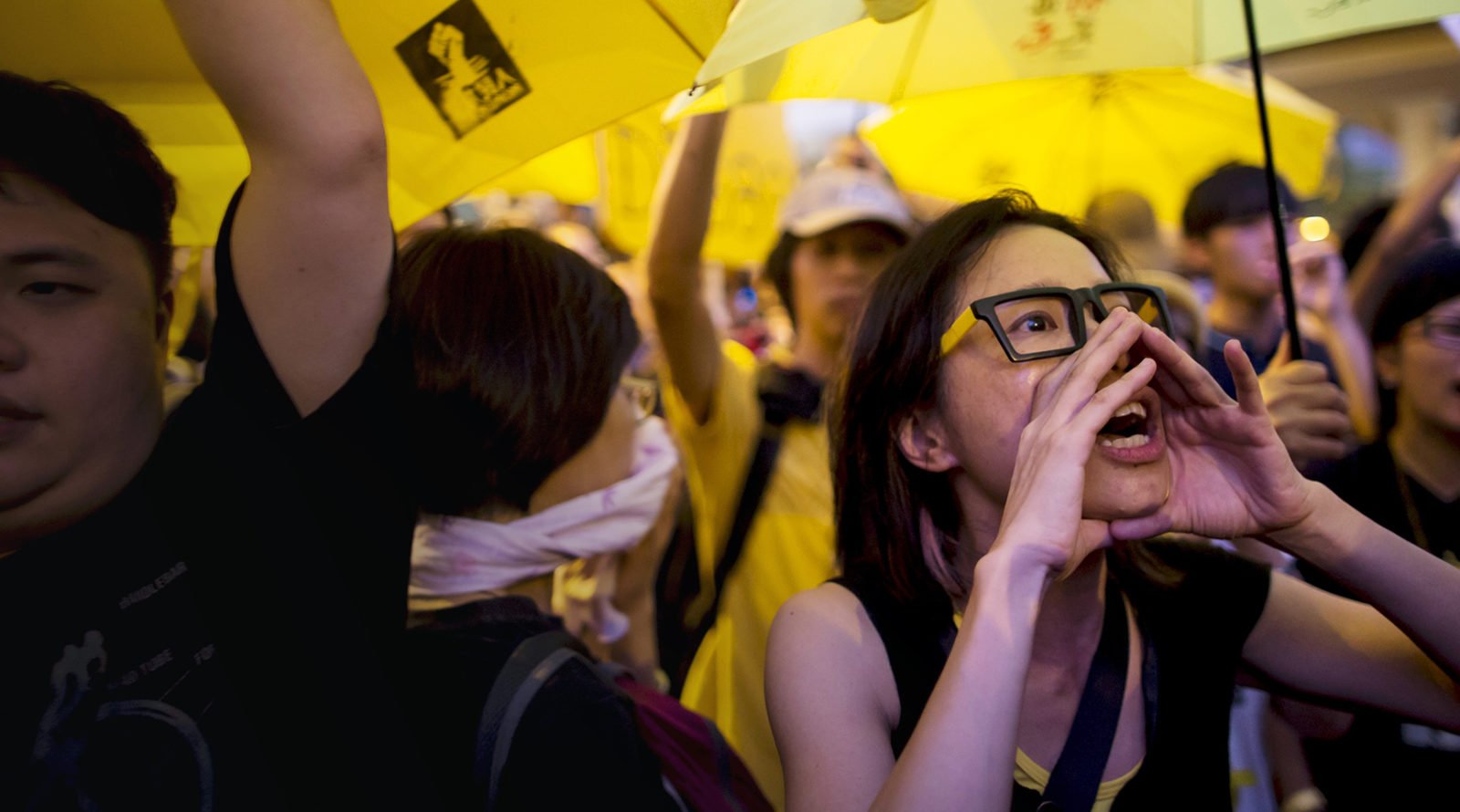 A pro-democracy protester shouts during a rally outside government headquarters in Hong Kong