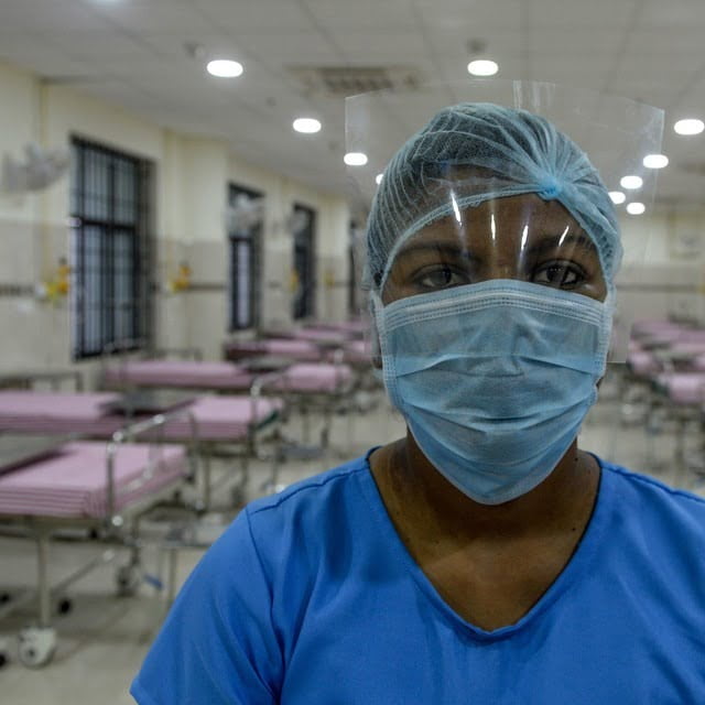 A medical staff wearing a facemask poses in an isolation ward at a newly inaugurated hospital by the Tamil Nadu state during a government-imposed nationwide lockdown as a preventive measure against the COVID-19 coronavirus, in Chennai on March 27, 2020.