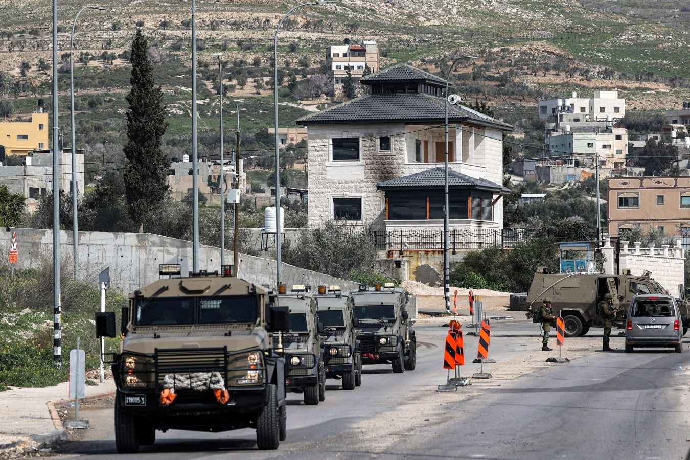 Israeli armoured vehicles are seen at the checkpoint at the northern entrance of Huwara near Nablus in the occupied West Bank.