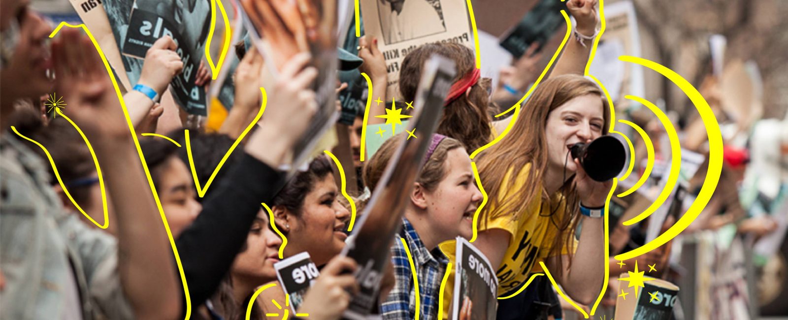 A line of young impassioned women protesting at a rally with raised fists and megaphones. The women are outlined by yellow lines.